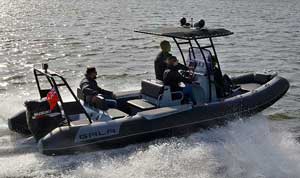 Crew boating on Lake Ontario in a Gala 21ft aluminum rigid inflatable boat (RIB) rigged with a Suzuki outboard motor.